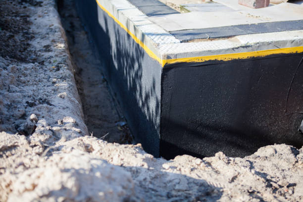Professional Waterproofing technician working in Clements, MD